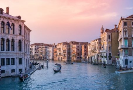 Italy Amalfi - photo of gondolas on body of water between buildings