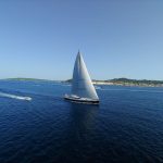 Luxury Cruise - black sail boat on sea