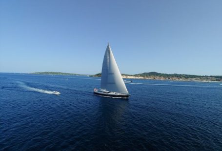 Luxury Cruise - black sail boat on sea
