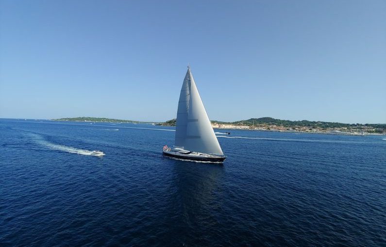 Luxury Cruise - black sail boat on sea