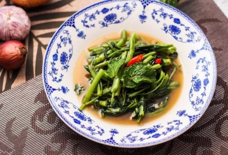 Gourmet Food Tour - a bowl of broccoli and other vegetables on a table