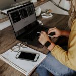 Packing List - person in blue denim jeans using macbook pro