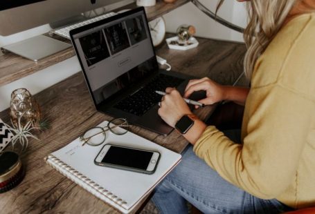 Packing List - person in blue denim jeans using macbook pro