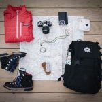 Outdoor Gear - black hiking backpack near white Fujifilm instax mini camera near black leather boots, red half-zip jacket, gray pocket watch on white map