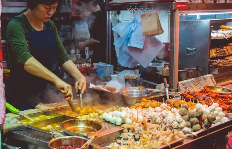 Street Food - woman cooking street foods
