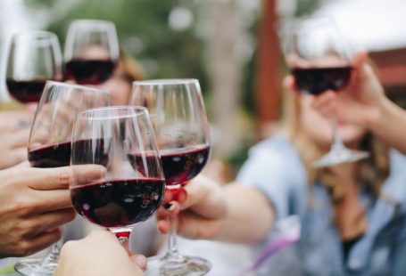 Wine Tasting - people tossing their clear wine glasses