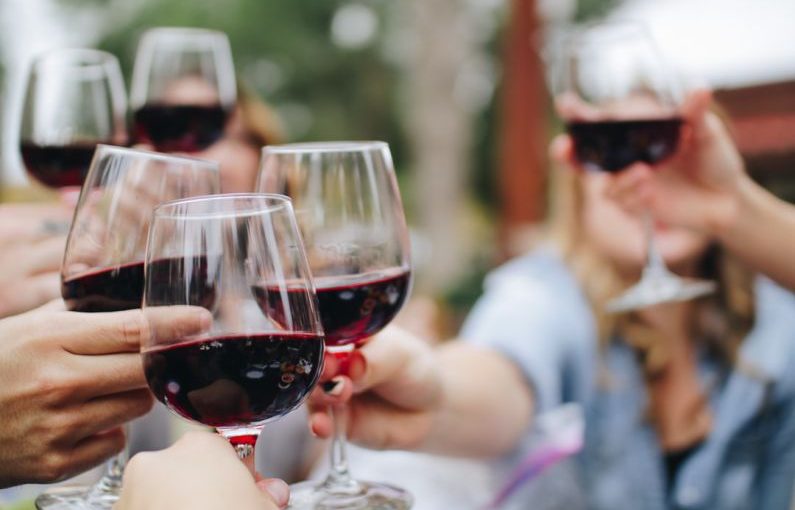 Wine Tasting - people tossing their clear wine glasses