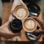 Coffee Culture - three person holding beverage cups