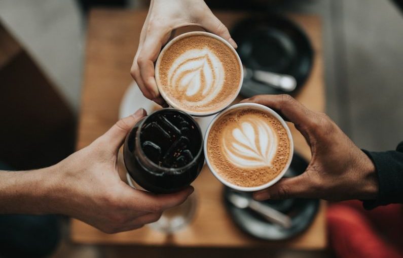 Coffee Culture - three person holding beverage cups