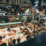 Seafood Market - man selling assorted foods