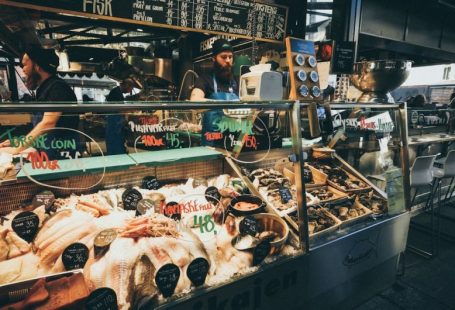 Seafood Market - man selling assorted foods