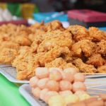 Local Delicacies - brown cookies on white ceramic plate