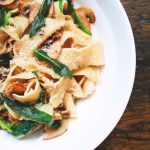 International Cuisine - pasta dish on white plate