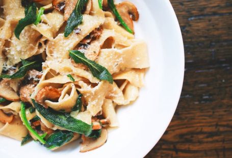 International Cuisine - pasta dish on white plate