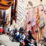 Morocco Market - man with two kids riding on a motorcycle