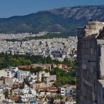 Tourist Trap - a group of people standing on top of a tall building