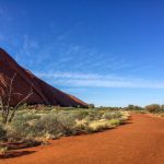 Australia Desert - brown sand near green grass under blue sky during daytime