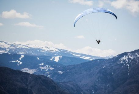 Paragliding Mountains - person doing xtreme sports parachute