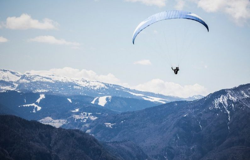 Paragliding Mountains - person doing xtreme sports parachute