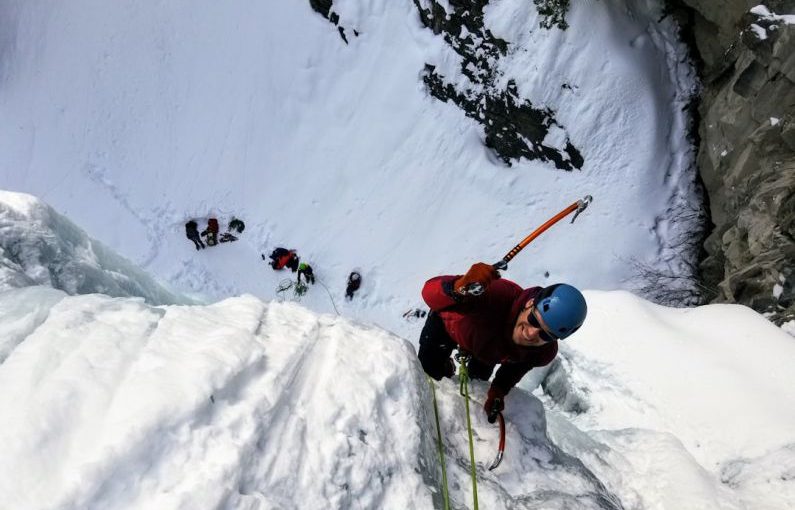 Ice Climbing - man wearing long-sleeved shirt climbing on mountain