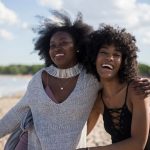 Traveler Friends - photo of woman beside another woman at seashore