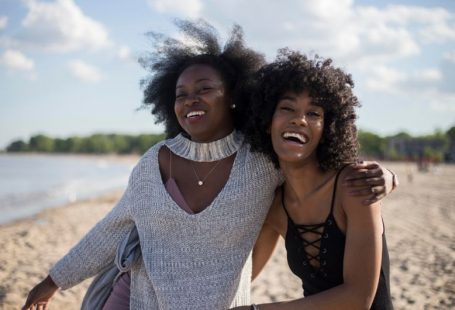 Traveler Friends - photo of woman beside another woman at seashore