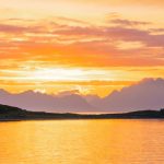 Norway Fjords - a body of water with mountains in the background