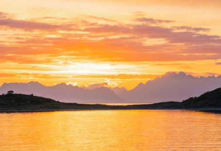 Norway Fjords - a body of water with mountains in the background