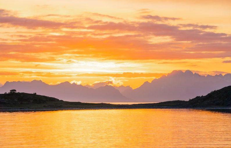 Norway Fjords - a body of water with mountains in the background