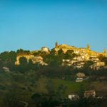 Cultural Travel - a hill with a village on top of it