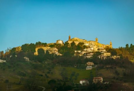 Cultural Travel - a hill with a village on top of it