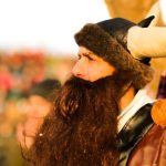 Cultural Clothing - a man with long hair and a beard wearing a horned hat