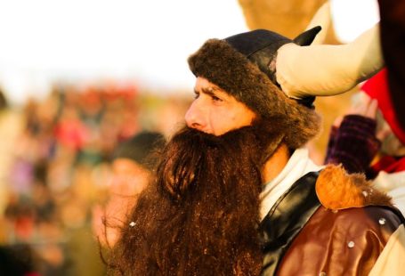 Cultural Clothing - a man with long hair and a beard wearing a horned hat