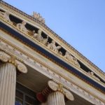 Cultural Photography - a close up of the top of a building with columns