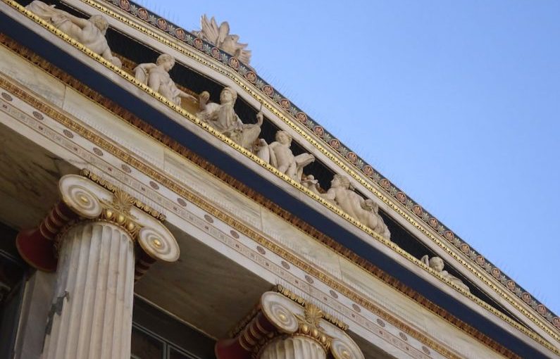 Cultural Photography - a close up of the top of a building with columns