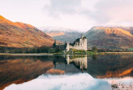 Scotland Highlands - gray concrete building near lake under white sky during daytime