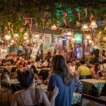 Street Food - people sitting on chair in restaurant