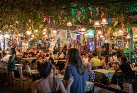 Street Food - people sitting on chair in restaurant