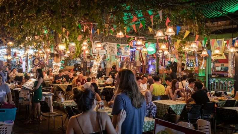 Street Food - people sitting on chair in restaurant