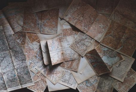 Solo Budget Travel - maps lying on the floor